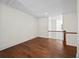 Empty hallway with hardwood floors and wooden railing at 10350 Alvin Rd, Johns Creek, GA 30022