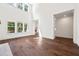 Spacious living area featuring hardwood floors, large windows, and abundant natural light at 10350 Alvin Rd, Johns Creek, GA 30022