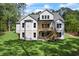 Beautiful new home with a walkout basement, deck and lush green lawn at 10350 Alvin Rd, Johns Creek, GA 30022