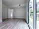 A stylish bedroom features modern wood-look flooring and sliding glass doors at 2400 Glenrock Dr, Decatur, GA 30032