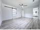 Bedroom features wood-look floors and a modern sliding barn door at 2400 Glenrock Dr, Decatur, GA 30032