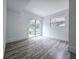 Bright bedroom featuring sliding glass doors and modern wood-look flooring at 2400 Glenrock Dr, Decatur, GA 30032