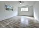 Sun-filled bedroom with modern wood-look floors and dual windows for natural light at 2400 Glenrock Dr, Decatur, GA 30032