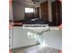Updated bedroom features a sliding barn door closet, new light wood floors, and modern fixtures at 2400 Glenrock Dr, Decatur, GA 30032