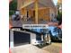 Renovated exterior features white paint, new garage door, landscaping, and wood porch at 2400 Glenrock Dr, Decatur, GA 30032
