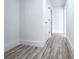 Hallway features wood-look floors, white paint, and interior doors at 2400 Glenrock Dr, Decatur, GA 30032