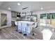 Modern kitchen with stainless steel appliances, island with seating, and a sliding door leading to the back deck at 2400 Glenrock Dr, Decatur, GA 30032