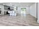 Open-concept kitchen featuring a modern island with seating, new appliances, and sliding glass doors to a deck at 2400 Glenrock Dr, Decatur, GA 30032