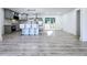 Modern kitchen with an island and barstool seating; sliding glass door leads to the backyard deck at 2400 Glenrock Dr, Decatur, GA 30032