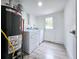 Laundry room with a washer and dryer, and a new hot water heater at 2400 Glenrock Dr, Decatur, GA 30032