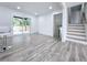 Living room featuring sliding glass doors to the backyard deck and stairs to the upper or lower level at 2400 Glenrock Dr, Decatur, GA 30032