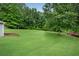 Spacious backyard surrounded by lush greenery and trees; perfect for recreation and relaxation at 260 Roberts Rd, Suwanee, GA 30024