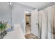 Well-lit bathroom featuring a vanity with counter space, a mirror, and a shower/tub combination at 260 Roberts Rd, Suwanee, GA 30024