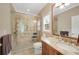 Bright bathroom features a large walk-in shower and granite-topped vanity at 260 Roberts Rd, Suwanee, GA 30024
