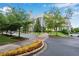 City Hall surrounded by lush landscaping and trees with beautiful walking paths at 260 Roberts Rd, Suwanee, GA 30024