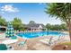 A scenic community pool with lounge seating and umbrellas at 260 Roberts Rd, Suwanee, GA 30024