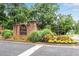 A welcoming community sign with landscaping and flowers at 260 Roberts Rd, Suwanee, GA 30024