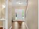 Bright foyer featuring hardwood floors, staircase, and half-bath in a neutral color palette at 260 Roberts Rd, Suwanee, GA 30024