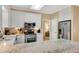 Charming kitchen features white cabinets, stainless appliances, and speckled granite countertops at 260 Roberts Rd, Suwanee, GA 30024