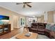Spacious living room with hardwood floors, a fireplace, and access to the backyard at 260 Roberts Rd, Suwanee, GA 30024