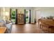 Relaxing living room featuring hardwood floors, sofa and a view to the home's entry at 260 Roberts Rd, Suwanee, GA 30024