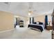 Spacious main bedroom with carpet and trey ceiling at 260 Roberts Rd, Suwanee, GA 30024