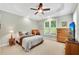 Serene main bedroom with tray ceilings, carpet floors, and natural light at 260 Roberts Rd, Suwanee, GA 30024