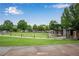 Picturesque park featuring a well-manicured lawn, outdoor stage, and trees at 260 Roberts Rd, Suwanee, GA 30024