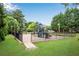 Community playground with slides, swings, and climbing structures in a fenced-in area at 260 Roberts Rd, Suwanee, GA 30024