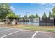 Well-maintained community tennis courts with lighting and a covered seating area at 260 Roberts Rd, Suwanee, GA 30024