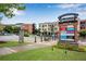 Town Center Suwanee sign in front of shops and restaurants with beautiful landscaping at 260 Roberts Rd, Suwanee, GA 30024