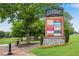 Town Center sign showing stores with flowers along a landscaped lawn at 260 Roberts Rd, Suwanee, GA 30024