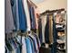 Organized walk-in closet with shelving, hanging rods, and ample storage space for clothes and accessories at 260 Roberts Rd, Suwanee, GA 30024