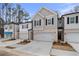 Attractive townhome with a two-car garage, neat landscaping, and a welcoming entrance at 520 Amethyst Way, Stockbridge, GA 30281