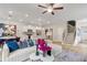 Spacious living area showcasing contemporary decor, adjoining kitchen, and staircase access at 520 Amethyst Way, Stockbridge, GA 30281