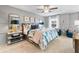 Cozy primary bedroom with a ceiling fan, carpet flooring, and natural light from the exterior window at 520 Amethyst Way, Stockbridge, GA 30281