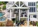 Aerial view of the home, showcasing the outdoor living spaces, including the pool and patio areas at 8957 Old Southwick Pass, Johns Creek, GA 30022
