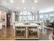 Gourmet kitchen with stainless steel ovens, marble countertops, and an open layout to the living spaces at 8957 Old Southwick Pass, Johns Creek, GA 30022