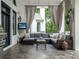 Relaxing outdoor space with comfortable seating, stylish decor, and a mounted television at 8957 Old Southwick Pass, Johns Creek, GA 30022