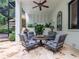 Inviting outdoor seating area with wrought iron chairs and table, and a decorative spiral staircase at 8957 Old Southwick Pass, Johns Creek, GA 30022