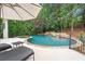 Beautiful backyard pool and spa with stone accents, waterfall feature, and lounge chairs at 8957 Old Southwick Pass, Johns Creek, GA 30022