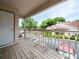 Outdoor balcony with wooden flooring and railing, offering views of the neighborhood at 904 Bridge Se Ln, Smyrna, GA 30082