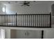 Open loft area with a ceiling fan overlooking a living space and filled with lots of natural light at 904 Bridge Se Ln, Smyrna, GA 30082