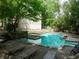 Community swimming pool with several lounge chairs for relaxing by the pool on a sunny day at 904 Bridge Se Ln, Smyrna, GA 30082