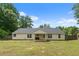 Beautiful home exterior with a spacious backyard and ample green space at 100 Gum Creek Lndg, Oxford, GA 30054