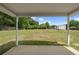 Spacious backyard features a storage shed, lush green lawn and surrounding greenery at 100 Gum Creek Lndg, Oxford, GA 30054
