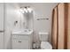 Bathroom featuring a shower curtain, vanity with a sink, and a toilet at 100 Gum Creek Lndg, Oxford, GA 30054