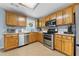 Functional kitchen featuring stainless steel appliances, ample counter space, and abundant storage at 100 Gum Creek Lndg, Oxford, GA 30054