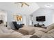 Bright living room with high ceilings, ceiling fan, open to the kitchen and comfortable seating at 100 Gum Creek Lndg, Oxford, GA 30054
