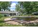 Backyard with an in-ground pool, patio, and surrounding greenery at 1095 Dallas Nebo Rd, Dallas, GA 30157